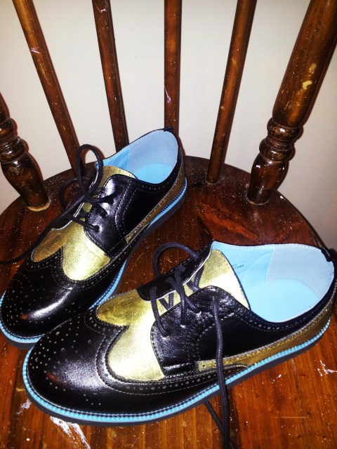 Black and gold brogues