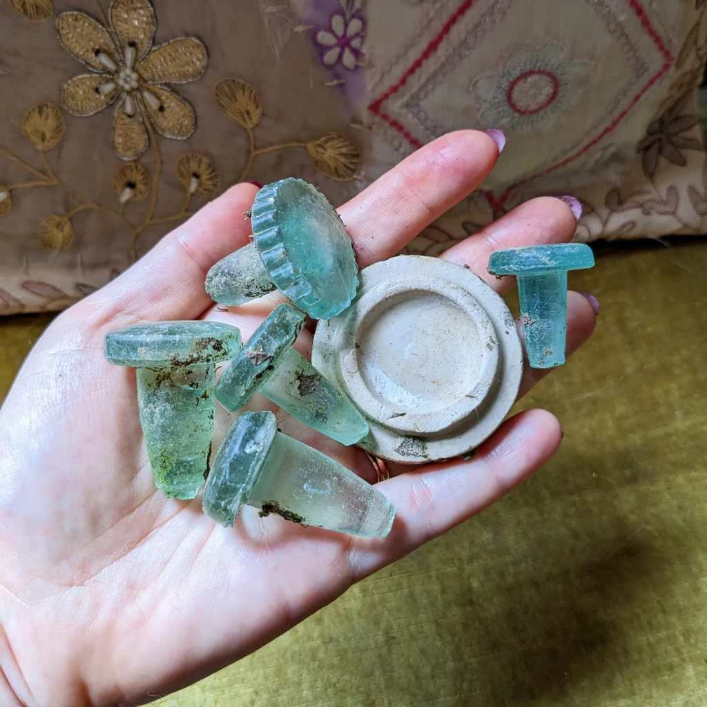 Glass and stoneware bottle stoppers.