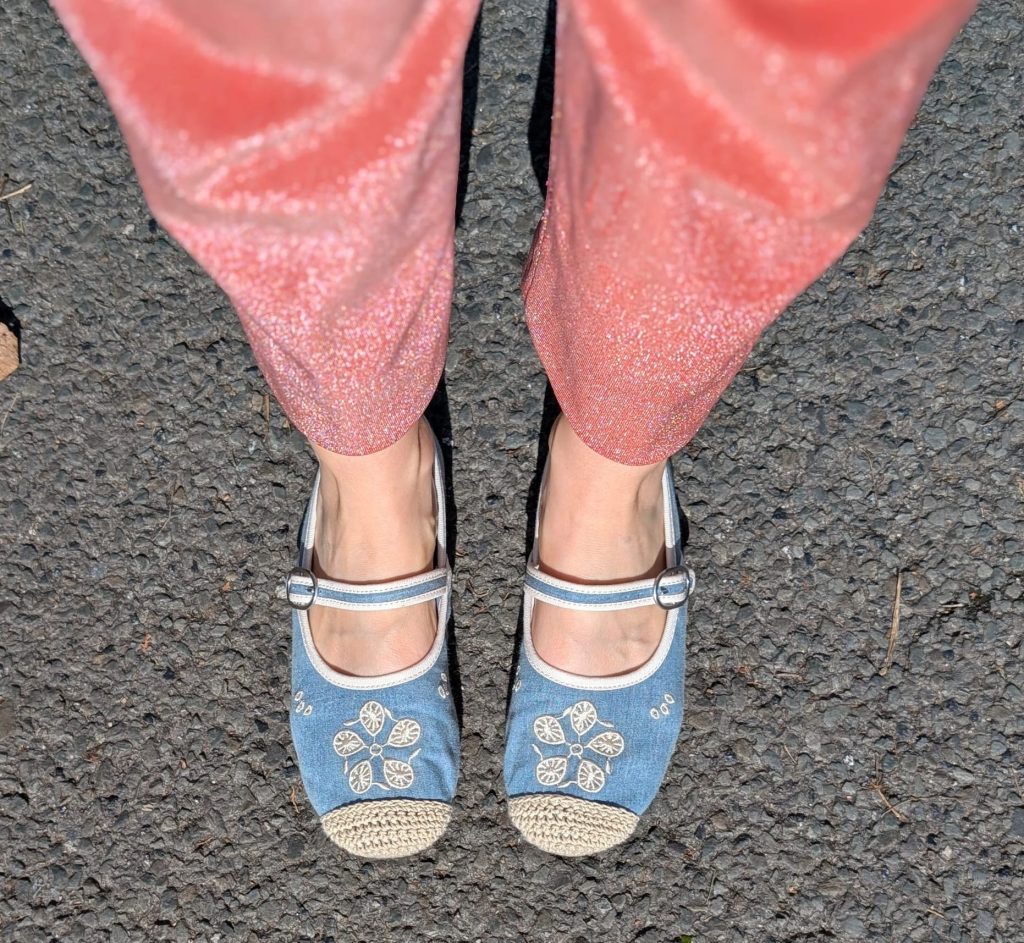 Honor wearing the glittery peach lurex suit trousers with pale blue Mary Jane ballet shoes