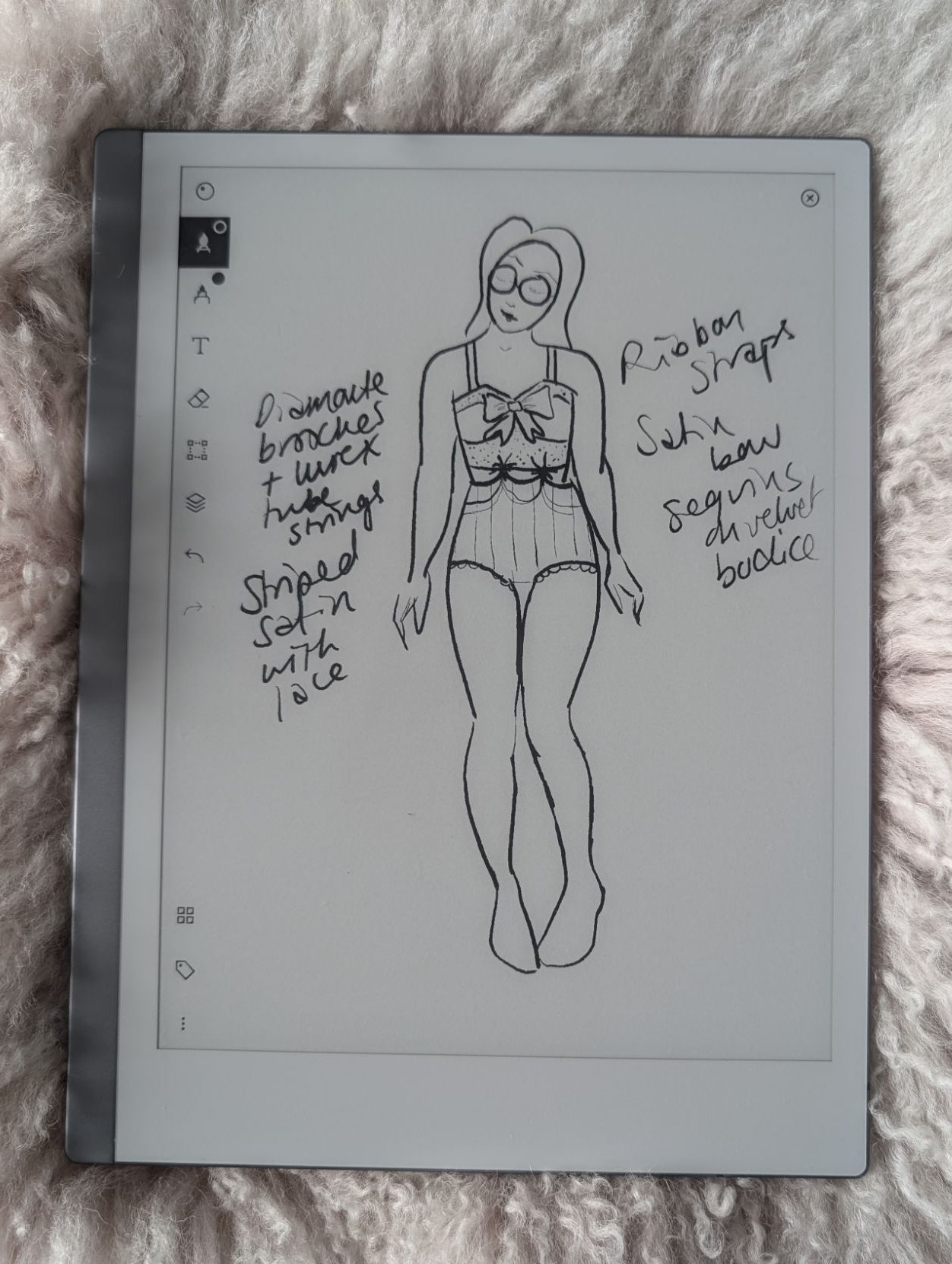 Honor's sketch on her Remarkable tablet, showing striped hot pants and a velvet bustier, attached by diamante appliques