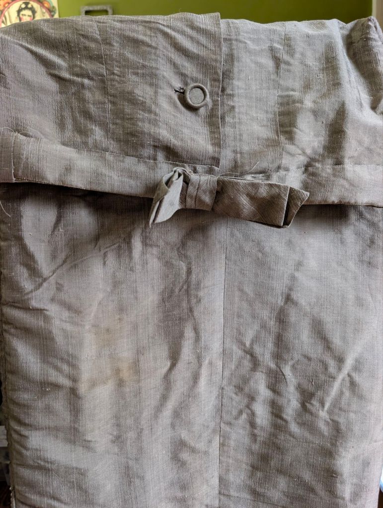 Grey silk 1960s dress suit with a stain